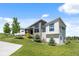 Striking exterior with stone accents, modern windows, and professional landscaping on a sunny day at 10205 Inspiration Dr, Parker, CO 80138