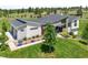Beautifully landscaped home featuring modern architecture, a well-manicured lawn, and a detached garage at 10205 Inspiration Dr, Parker, CO 80138