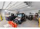 Spacious garage equipped with ample storage, work space, and room for multiple vehicles at 10205 Inspiration Dr, Parker, CO 80138