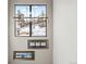 Hallway with modern lighting fixture and scenic artwork leading to other areas of the home at 10205 Inspiration Dr, Parker, CO 80138