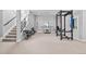 Finished basement gym with squat rack and weight equipment at 10205 Inspiration Dr, Parker, CO 80138