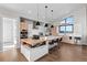 Well-lit kitchen boasting sleek countertops, a large island with seating, and modern appliances at 10205 Inspiration Dr, Parker, CO 80138