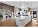 Modern kitchen with a large island, open to the dining and living areas, perfect for entertaining at 10205 Inspiration Dr, Parker, CO 80138