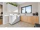 Well-lit laundry room with modern appliances, ample counter space, and stylish cabinets at 10205 Inspiration Dr, Parker, CO 80138