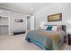 Comfortable main bedroom features carpeted floor, walk-in closet, and decorative wall art at 10205 Inspiration Dr, Parker, CO 80138