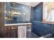 Shower with blue subway tile, gold hardware and a window at 1022 N Pearl St # 101, Denver, CO 80203