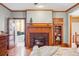 Bedroom with a fireplace and doorway into a luxurious bathroom at 1022 N Pearl St # 101, Denver, CO 80203
