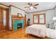 Bedroom featuring wood trim, decorative fireplace, stylish windows and hardwood parquet floors at 1022 N Pearl St # 101, Denver, CO 80203