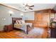 Bedroom featuring a wooden bed frame, sconces, built-in storage, and hardwood floors at 1022 N Pearl St # 101, Denver, CO 80203