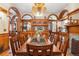 Elegant dining room with a large table, wood accents, and beautiful architectural details at 1022 N Pearl St # 101, Denver, CO 80203