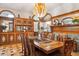A dining room features a fireplace, stunning stained glass and wood details with a table and chairs at 1022 N Pearl St # 101, Denver, CO 80203