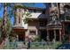 Stately home featuring unique architectural details, manicured landscaping, and a wrought-iron fence for added curb appeal at 1022 N Pearl St # 101, Denver, CO 80203