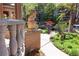 Charming walkway lined with lush greenery and elegant stone accents, leading to a beautifully maintained home at 1022 N Pearl St # 101, Denver, CO 80203