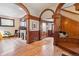 Inviting foyer featuring hardwood floors, rich wood detailing, and a grand staircase with bench seating at 1022 N Pearl St # 101, Denver, CO 80203
