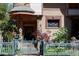 Inviting home exterior featuring decorative stonework, charming front garden, and a turret-style entryway at 1022 N Pearl St # 101, Denver, CO 80203