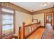 Hallway with hardwood floors, leaded glass window, and decorative trim at 1022 N Pearl St # 101, Denver, CO 80203