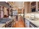 A luxury kitchen features a stainless steel fridge, stone countertops, and high-end appliances at 1022 N Pearl St # 101, Denver, CO 80203