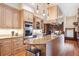 A modern kitchen with wood floors and stone countertops and stainless steel appliances at 1022 N Pearl St # 101, Denver, CO 80203