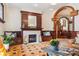 Elegant living room with a fireplace, hardwood floors, built-in benches, and decorative wood accents at 1022 N Pearl St # 101, Denver, CO 80203