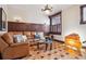Cozy living room featuring hardwood floors, stylish furnishings, and a large window with natural light at 1022 N Pearl St # 101, Denver, CO 80203