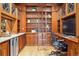 Home office featuring custom wood cabinetry, built-in shelving, and a rolling ladder for easy access at 1022 N Pearl St # 101, Denver, CO 80203