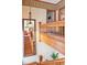Staircase featuring a beautiful chandelier, a large mirror, and wood banisters at 1022 N Pearl St # 101, Denver, CO 80203