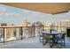 Spacious balcony with an outdoor table and seating, offering stunning city views at 1133 14Th St # 3320, Denver, CO 80202