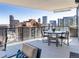 Outdoor balcony with beautiful lounge furniture and stunning views of the city skyline at 1133 14Th St # 3320, Denver, CO 80202