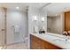 Bright bathroom featuring updated fixtures, including a glass shower, and white vanity at 1133 14Th St # 3320, Denver, CO 80202