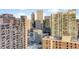 Panoramic view of the city skyline from a high-rise vantage point, showcasing urban living at 1133 14Th St # 3320, Denver, CO 80202