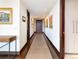 Hallway featuring contemporary art, recessed lighting and rich hardwood trim at 1133 14Th St # 3320, Denver, CO 80202