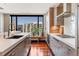 Modern kitchen with stainless steel appliances, sleek countertops and city views from large windows at 1133 14Th St # 3320, Denver, CO 80202
