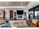 Cozy living room with a fireplace, built-in shelving, and comfortable seating at 1133 14Th St # 3320, Denver, CO 80202