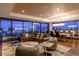 Living room featuring an open layout, floor to ceiling windows, and skyline views at night at 1133 14Th St # 3320, Denver, CO 80202