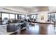 Bright living room with floor-to-ceiling windows offering panoramic city views and dark wood flooring at 1133 14Th St # 3320, Denver, CO 80202