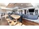 Spacious living space featuring a dining table, modern kitchen, living room and hardwood floors at 1133 14Th St # 3320, Denver, CO 80202