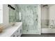 Elegant bathroom with a glass-enclosed shower, soaking tub, and modern vanity at 2966 Casalon Cir, Superior, CO 80027