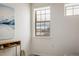 Bright bedroom featuring mountain views from the window and an artistic display shelf at 2966 Casalon Cir, Superior, CO 80027