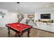 Spacious game room with a pool table, a comfortable seating area, and a bar at 2966 Casalon Cir, Superior, CO 80027