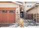 Close-up of home's garage exterior with brick, address 2966, with adjacent gate entrance at 2966 Casalon Cir, Superior, CO 80027