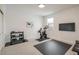 Home gym featuring weight rack, stationary bike, TV, and ample space for exercise at 2966 Casalon Cir, Superior, CO 80027