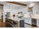 Bright kitchen with stainless steel appliances, a large island, and modern white cabinetry at 2966 Casalon Cir, Superior, CO 80027