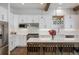 Bright and modern kitchen featuring white cabinets, stainless steel appliances, and quartz countertops at 2966 Casalon Cir, Superior, CO 80027