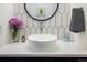 Stylish powder room featuring a vessel sink, modern fixtures, and unique accent wall at 2966 Casalon Cir, Superior, CO 80027