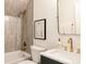 Stylish bathroom featuring marble countertops and bronze fixtures at 940 N Ogden, Denver, CO 80218