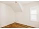 Bright bedroom with hardwood floors, natural light, and modern light fixture at 940 N Ogden, Denver, CO 80218