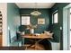 Charming dining area with built-in seating, wood table, and stylish light fixture for cozy meals at 940 N Ogden, Denver, CO 80218