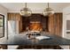 Modern kitchen with a spacious island, stainless steel appliances, and pendant lighting at 940 N Ogden, Denver, CO 80218