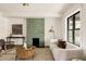 Modern living room featuring a tiled fireplace, hardwood floors, and comfortable seating at 940 N Ogden, Denver, CO 80218