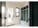Functional mud room with built-in storage and marble tile flooring at 940 N Ogden, Denver, CO 80218
